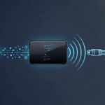 Diagram-style illustration showing an HDMI signal being converted into a radio-frequency signal for coaxial cable distribution